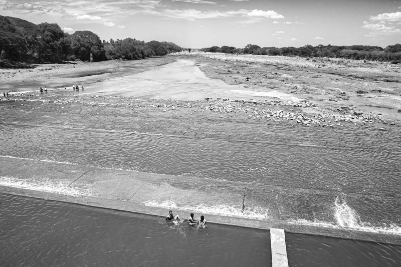 The Kaveri irrigation river flowing out from behind the Kaveri Regulator - at Grand Anicut in Thanjavur district, Tamil Nadu